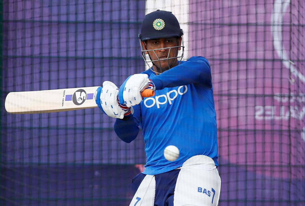 India's MS Dhoni hits one during a training session on Monday. Reuters
