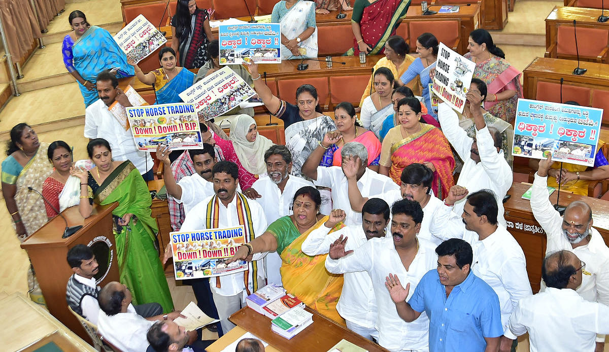 The protest during the starred subject meeting at the council hall prompted Mayor Gangambike Mallikarjun to adjourn proceedings by a day.