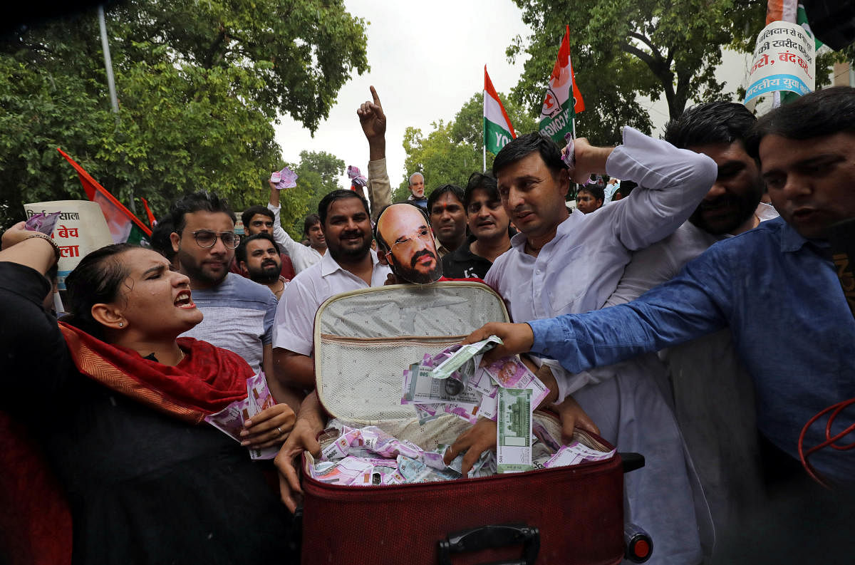Activists of the youth wing of India's main opposition Congress party shout slogans during a protest against what they say are attempts by the ruling Bharatiya Janata Party (BJP) to topple the Janata Dal (Secular)-Congress coalition government in the sout