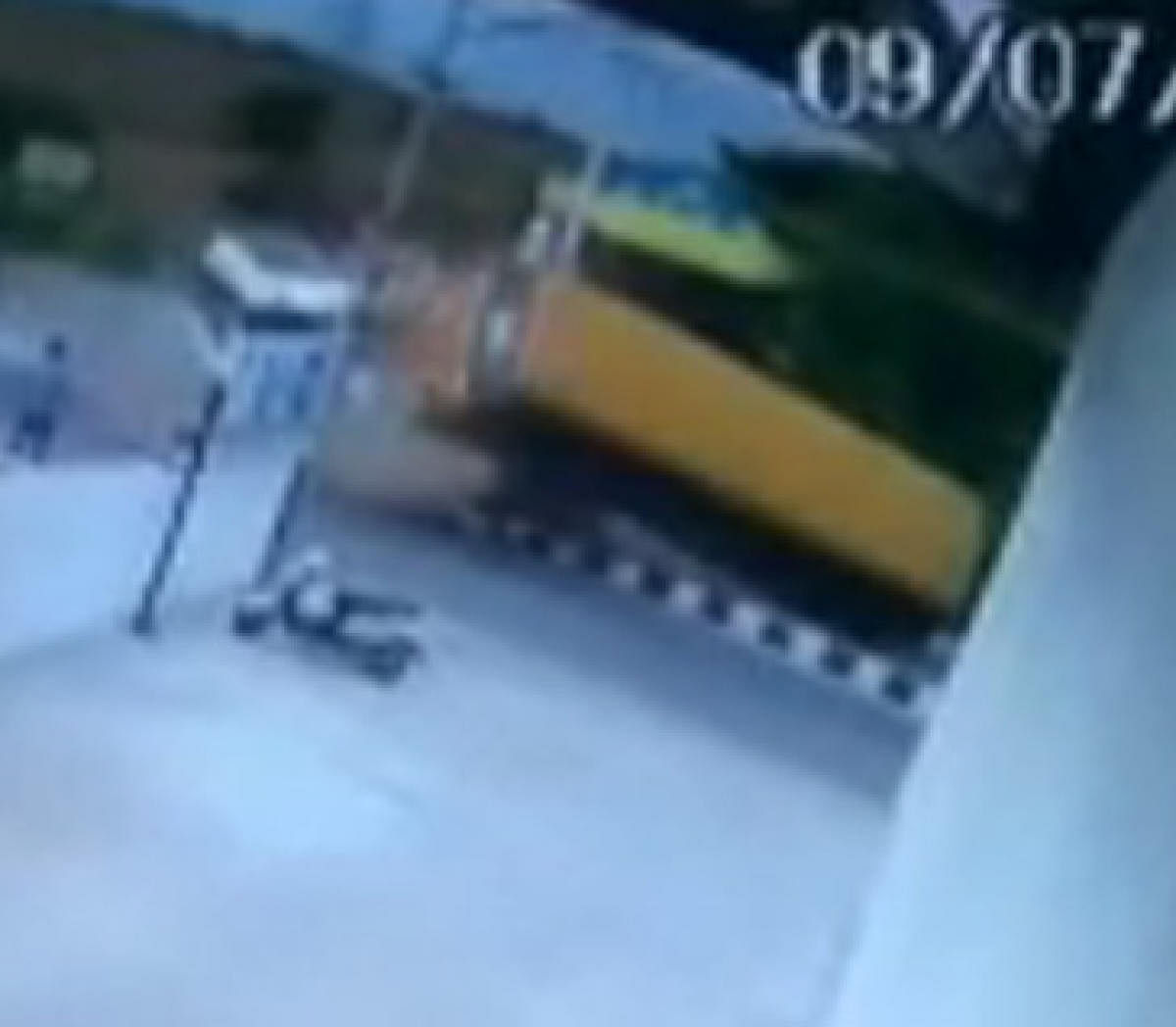 A CCTV Footage of... A school bus belonging to an international school toppled after a Tempo Traveller whose driver lost control and collided with the side of the bus causing it to topple at Ragihalli Gate in Bannerghatta on Tuesday.