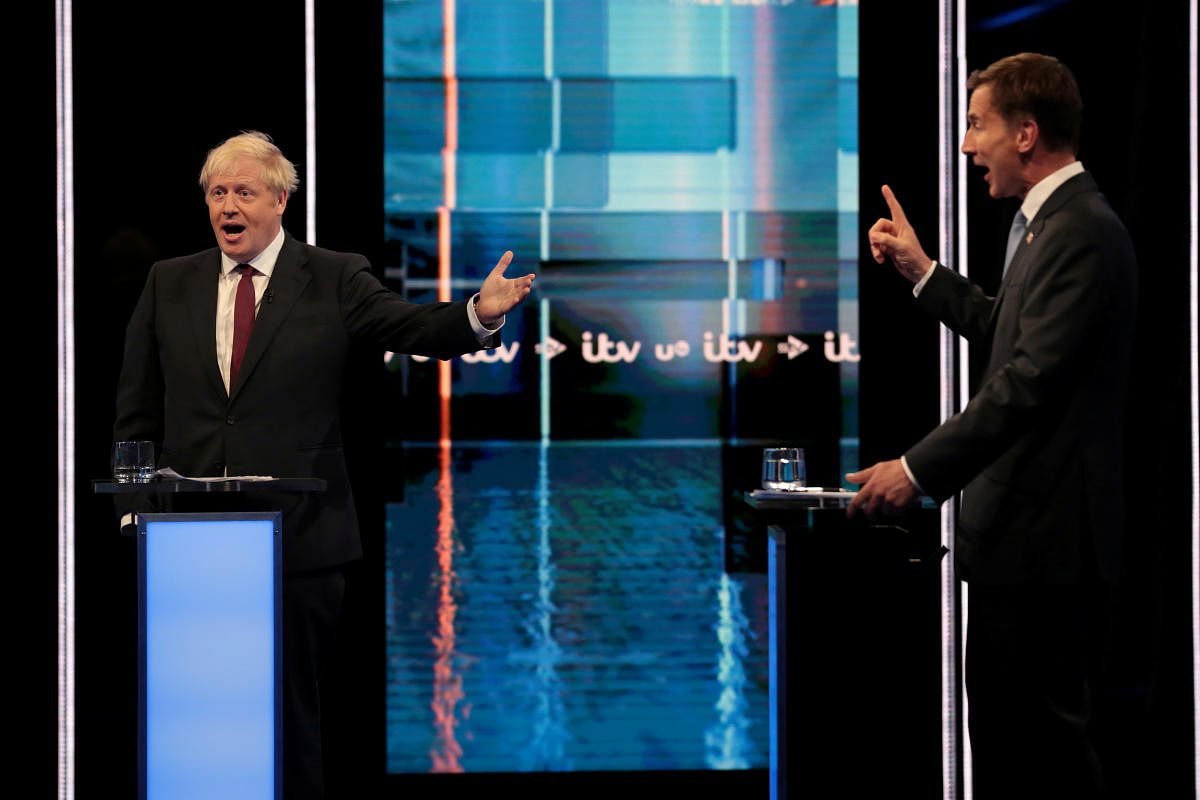 Boris Johnson and Jeremy Hunt, leadership candidates for Britain's Conservative Party, attend Britain's Next Prime Minister: The ITV Debate at MediaCityUK in Salford. (Reuters Photo)