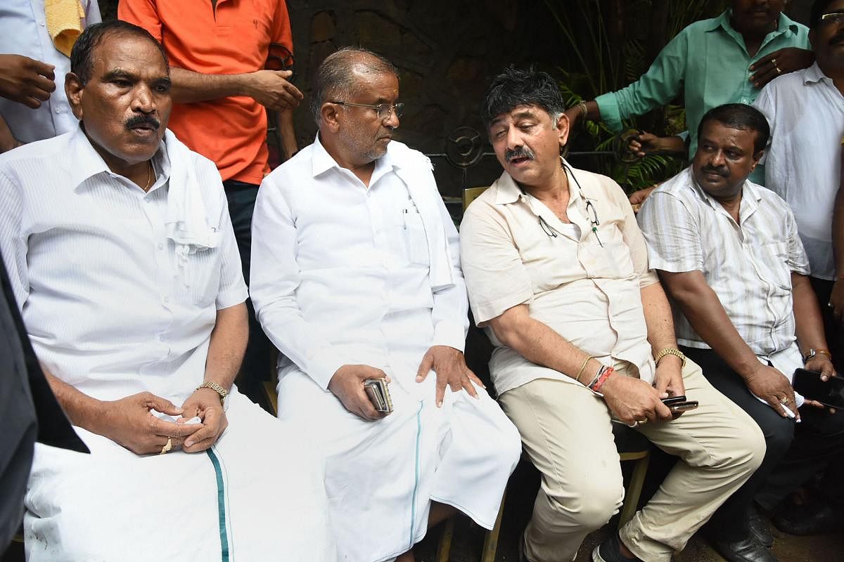 Karnataka Minister D K Shivakumar and G T Devegowda at a hotel in Mumbai, Wednesday, July 10, 2019. Shivakumar, who was accompanied by senior JD(S) MLAs, told reporters that he had booked a room in the hotel but was not being allowed to enter. (PTI Photo)