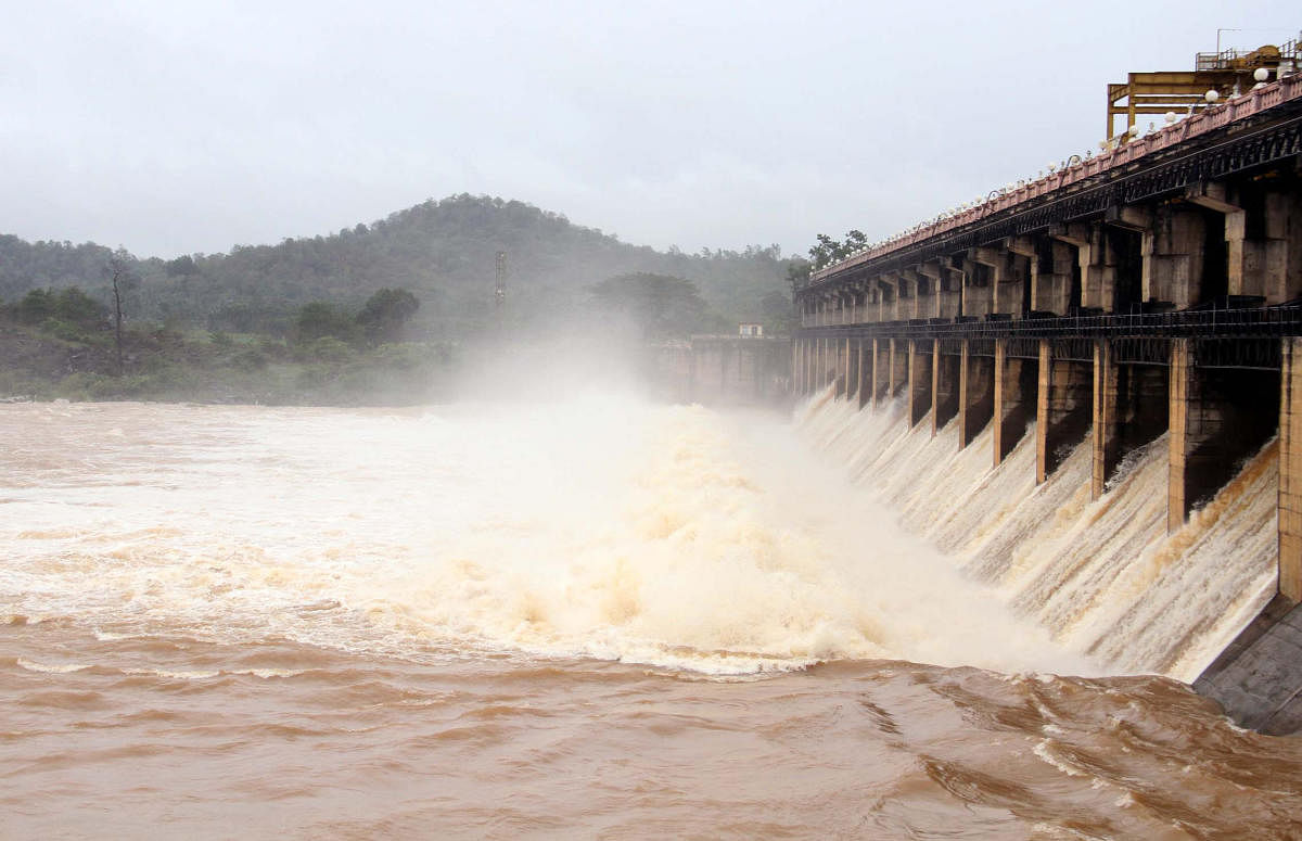 A total of 17,200 cusecs of water was released from 13 crest gates of Tunga dam, at Gajanur in Shivamogga district on Wednesday, after the reservoir reached its maximum level of 588.24 metre. DH PHOTO