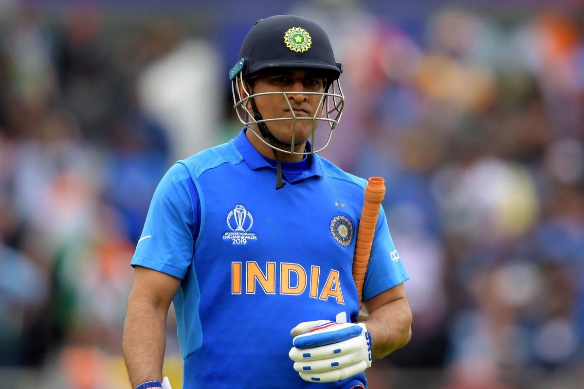 Former captain Sourav Ganguly and VVS Laxman said India committed a "tactical blunder" by demoting Mahendra Singh Dhoni to number seven in the World Cup semifinal against New Zealand, a move that left them baffled. (AFP Photo)