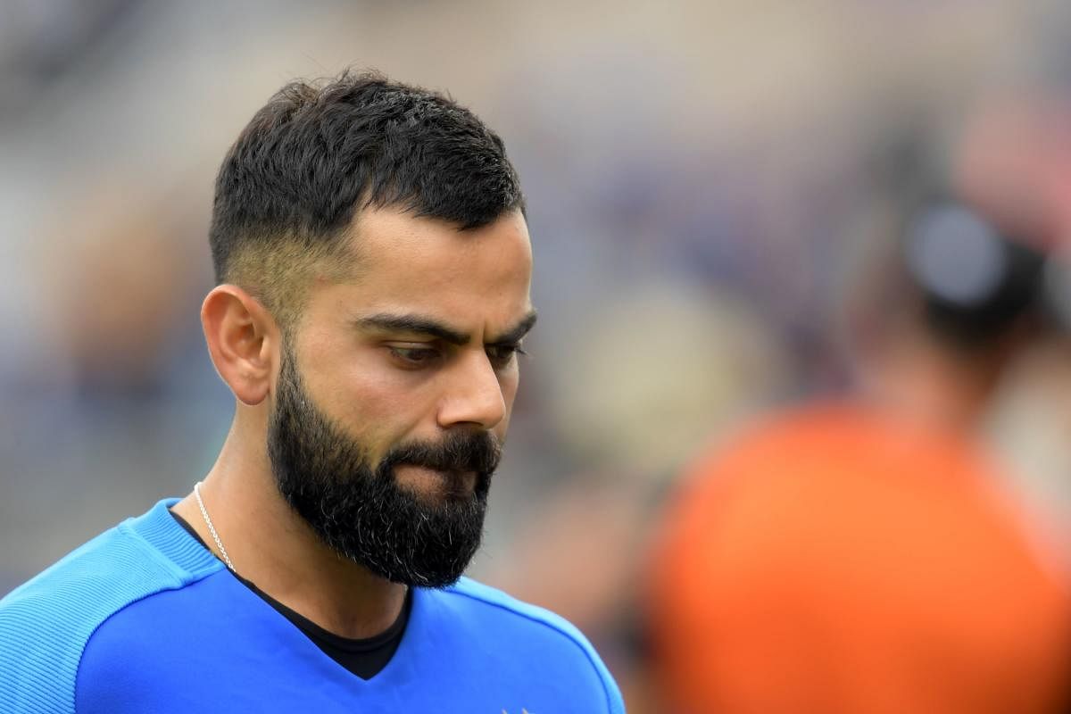 Virat Kohli reacts at the end of play during the 2019 Cricket World Cup first semi-final between New Zealand and India at Old Trafford in Manchester. New Zealand beat India by 18 runs. AFP