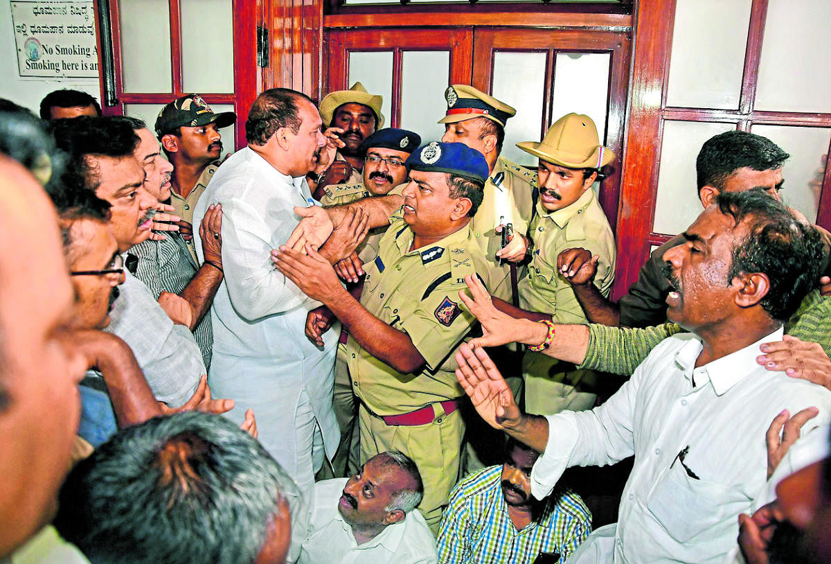 Police intervene after BJP leaders protest the detention of MLA K Sudhakar in Vidhana Soudha. DH photo/Krishnakumar P S