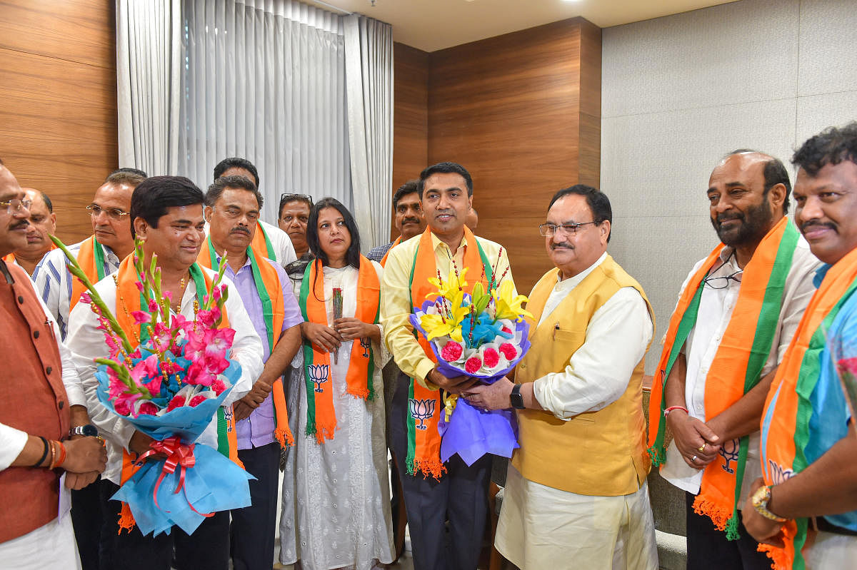 BJP Working President JP Nadda with Goa Chief Minister Pramod Sawant (yellow shirt), Chandrakant Babu Kavlekar, the leader of opposition in the Goa Assembly, and other Goa Congress rebel MLAs, in New Delhi on Thursday. PTI photo
