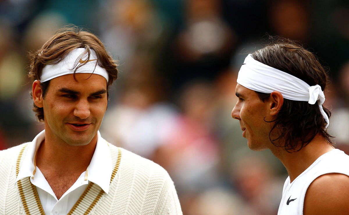 Roger Federer and Rafael Nadal battle for a place in the Wimbledon final on Friday, 11 years after they mesmerised Centre Court in a Grand Slam championship. (File Photo)