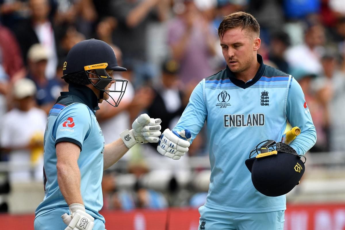 England's Joe Root (L) comes on as England's Jason Roy walks off for 85 during the 2019 Cricket World Cup. (AFP Photo)