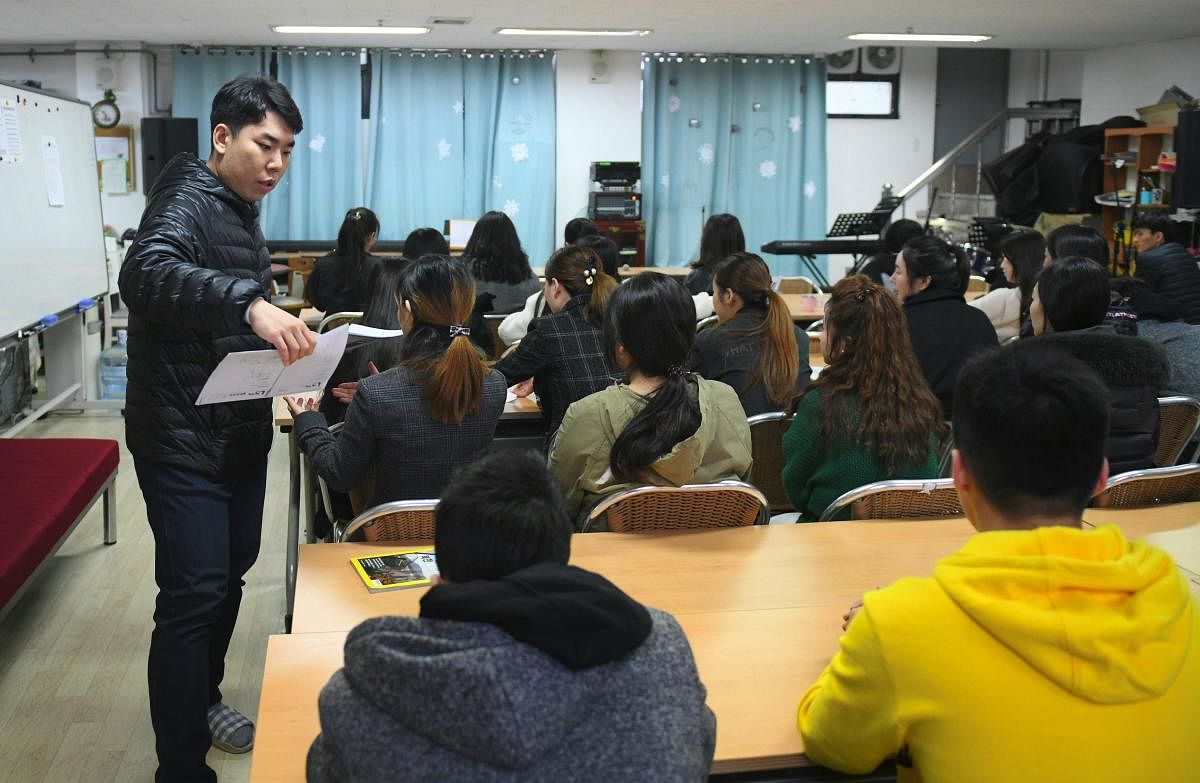 Students studying in a lesson at Wooridul School in Seoul, an educational haven for North Korean defectors too old to go to appropriate state schools. (AFP Photo)