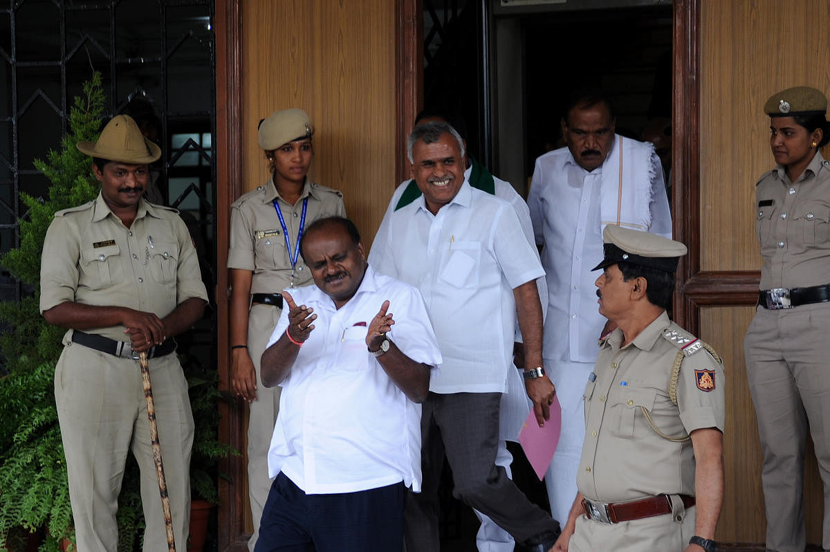 Chief Minister HD Kumaraswamy walks out of at Vidhana Soudha in Bengaluru on Thursday. | DH Photo: Pushkar V