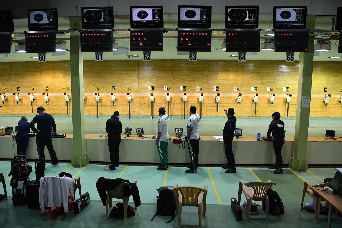 Shooters practice at the Dr Karni Singh Range ahead of the World Cup. AFP