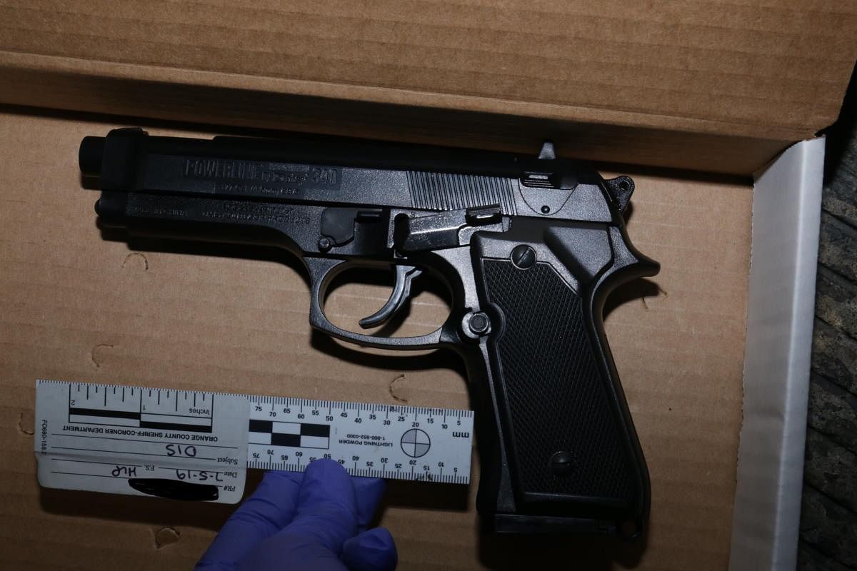 This unlocated handout photo released by the Orange County District Attorney's Office on July 9, 2019 shows a replica handgun designed to look identical to a Beretta 92 FS handgun which was recovered from near a shooting victim at the scene of an officer-