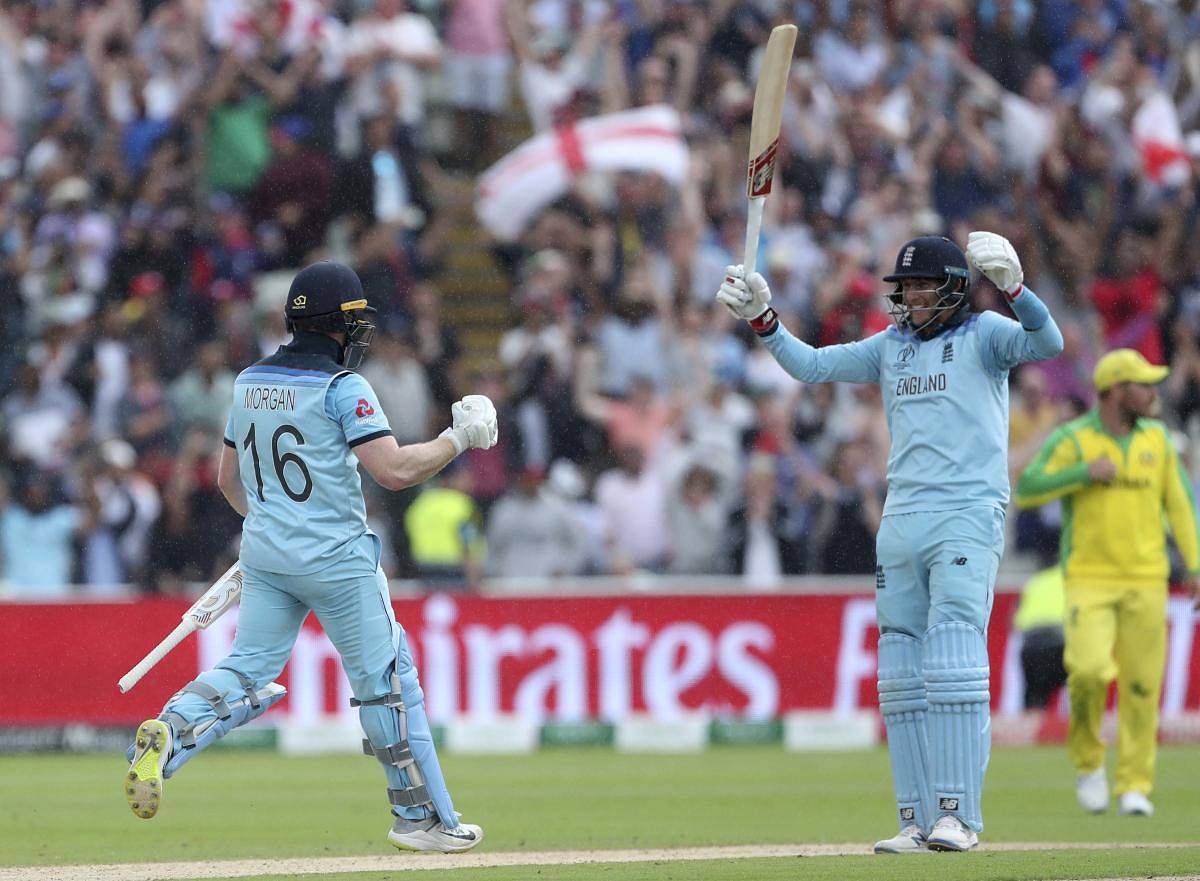 Birmingham: England's captain Eoin Morgan, left, and Joe Root celebrate their win over Australia in the Cricket World Cup semi-final match at Edgbaston in Birmingham, England, Thursday, July 11, 2019. AP/PTI