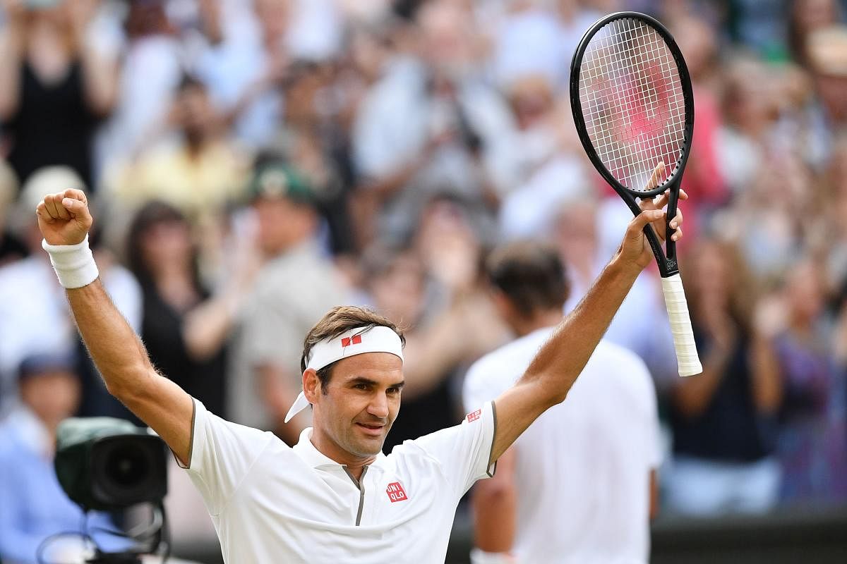 Switzerland's Roger Federer celebrates beating Spain's Rafael Nadal during their men's singles semi-final match. AFP photo