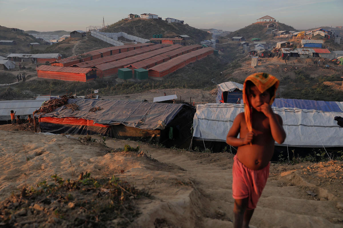 A Rohingya refugee child stands on a hill above the camp for widows and orphans inside the Balukhali camp near Cox's Bazar, Bangladesh. (Reuters File Photo)