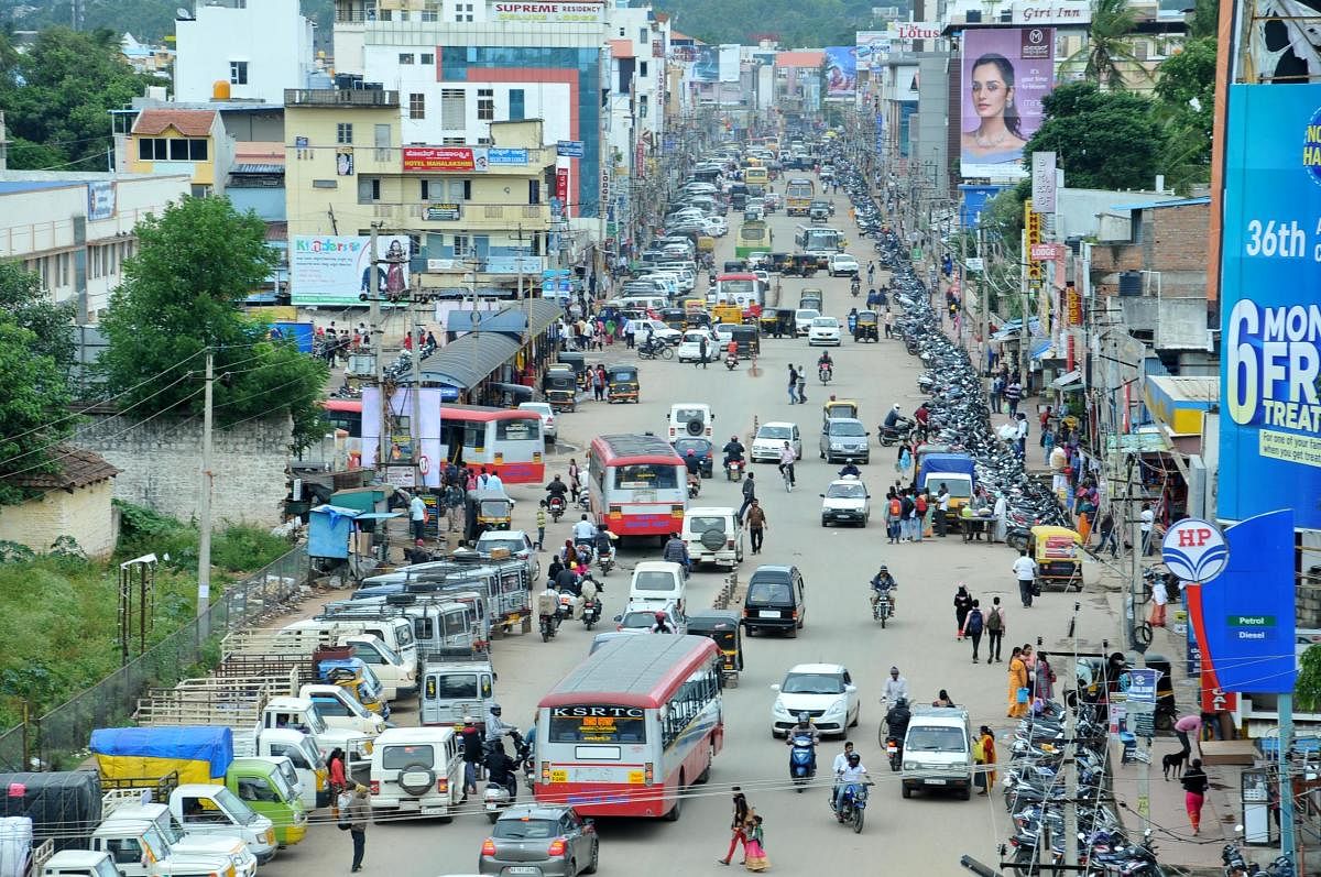 The increased density of vehicles on I G Road in Chikkamagaluru.