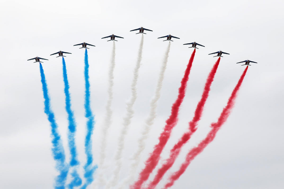 Alpha jets from the French Air Force Patrouille de France fly during the traditional Bastille Day military parade on the Champs-Elysees Avenue in Paris. (Reuters Photo)