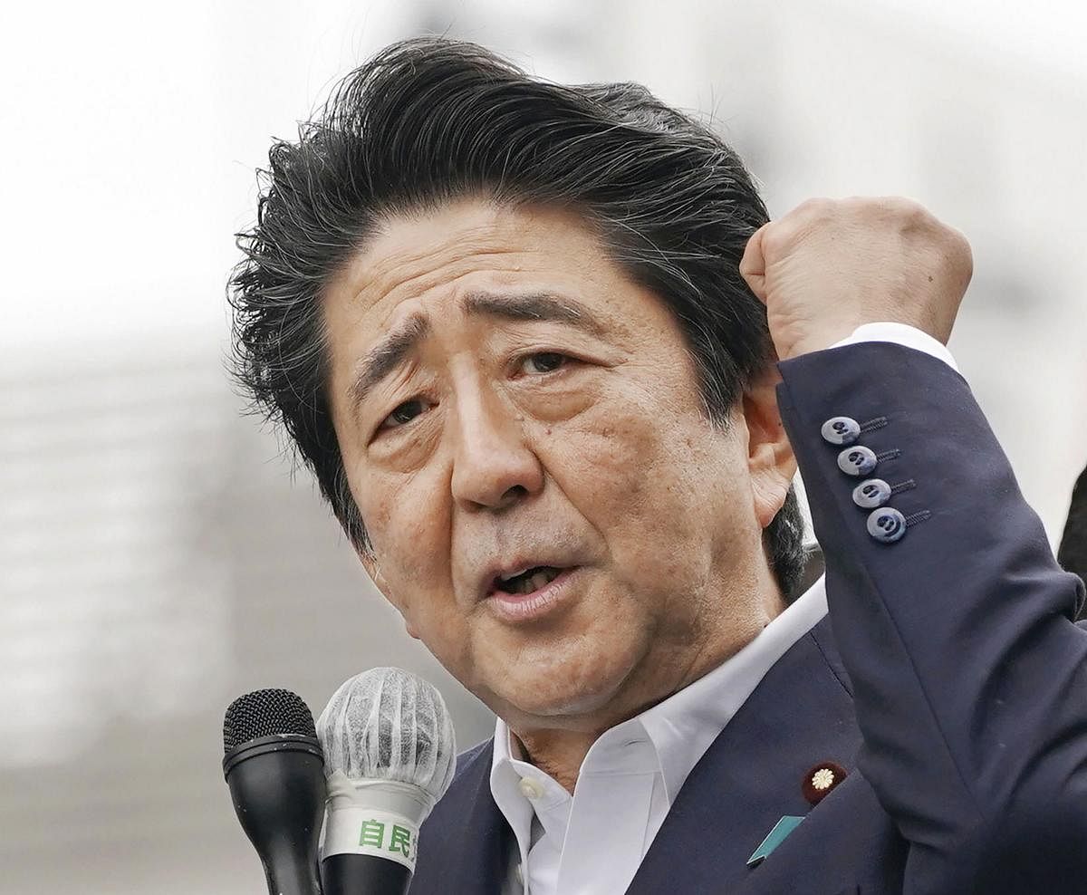 Funabashi: Japan's Prime Minister and leader of the Liberal Democratic party Shinzo Abe delivers a speech on a street ahead of the Upper House election, in Funabashi, near Tokyo Sunday, July 7, 2019. AP/PTI