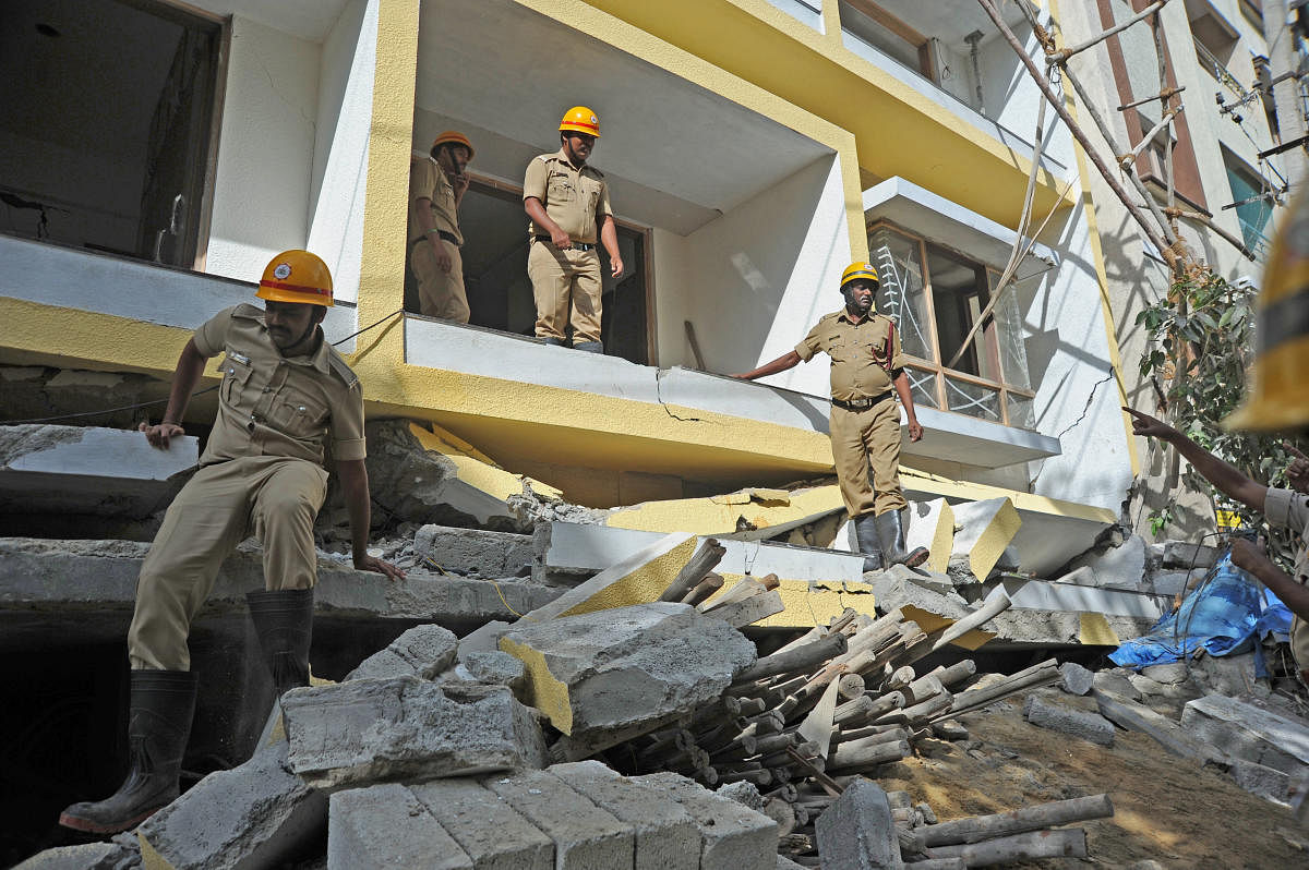 Five people were killed when two adjacent four-storey buildings slumped one after another in Cooke Town, Bengaluru, on July 10. DH FILE PHOTO