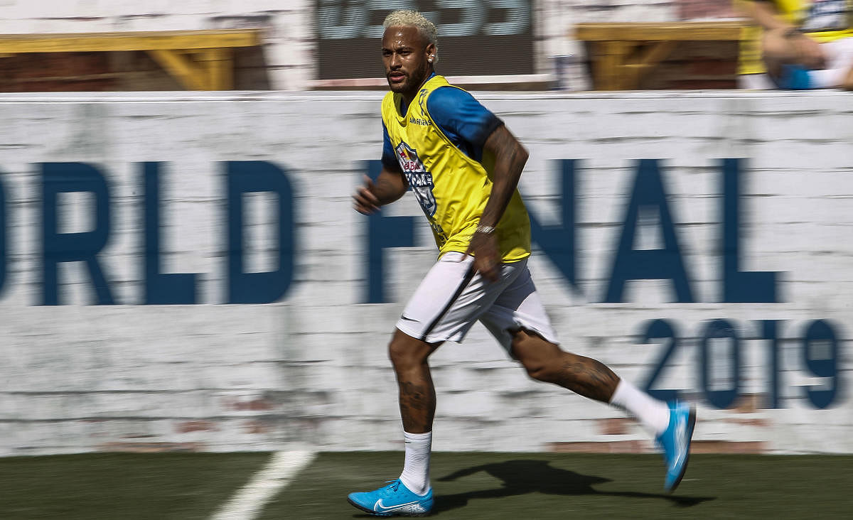 Brazilian football star Neymar runs during a five-a-side football tournament for his charity Neymar Junior Project Institute, in Praia Grande, Sao Paulo, Brazil, on July 13, 2019. (AFP)