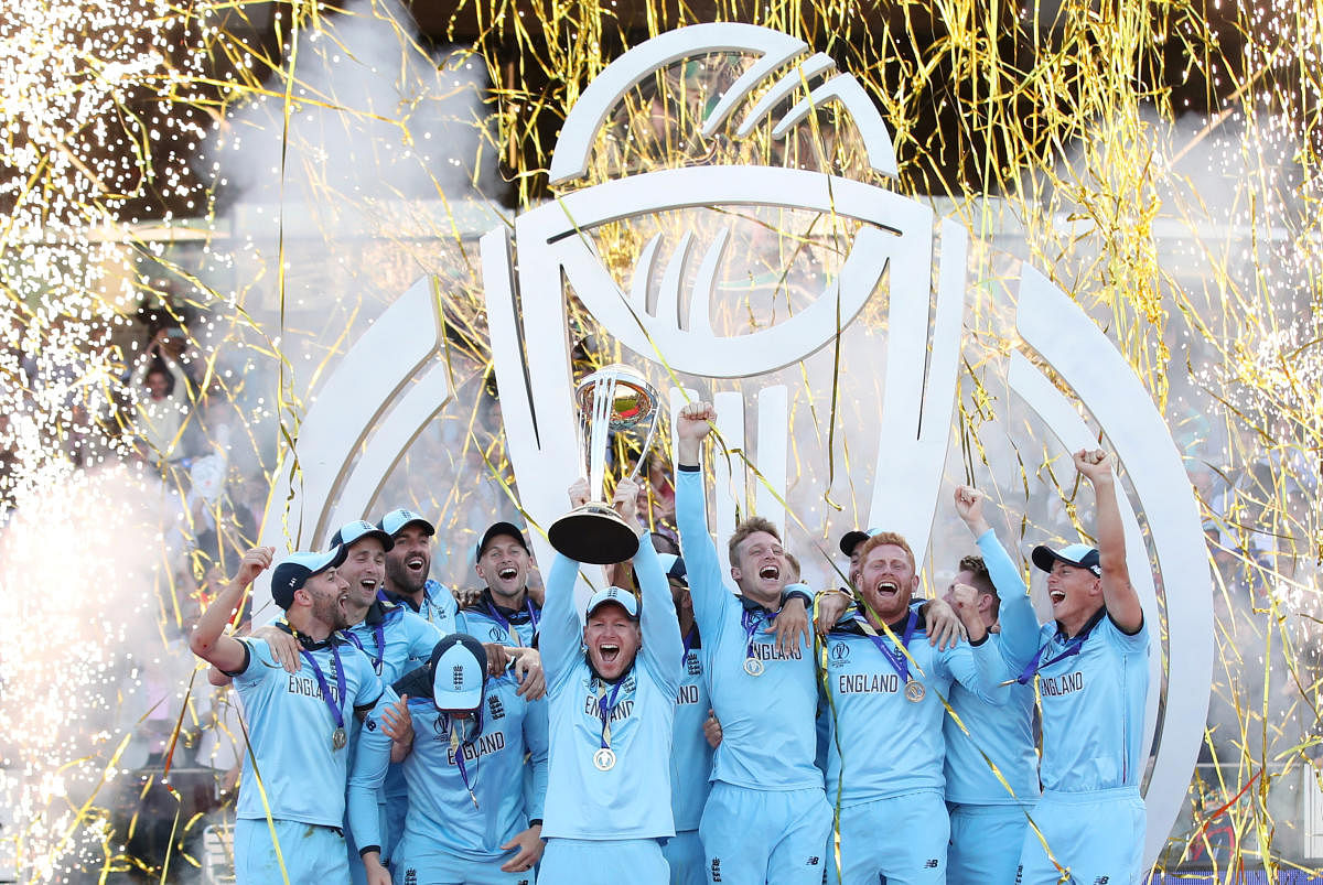 England celebrate winning the world cup with the trophy. Reuters