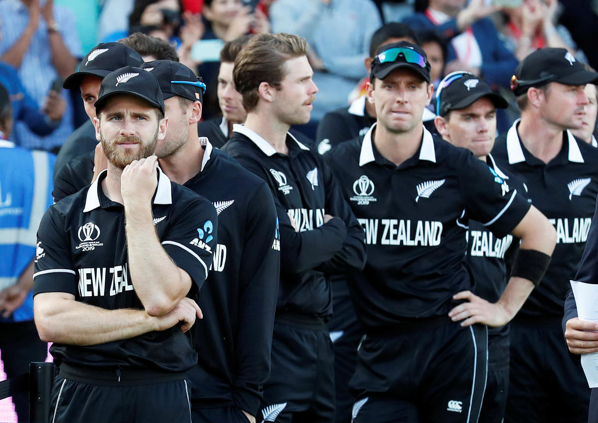 WINNING HEARTS: New Zealand captain Kane Williamson (left) appears dejected during the presentation ceremony on Sunday. Reuters 