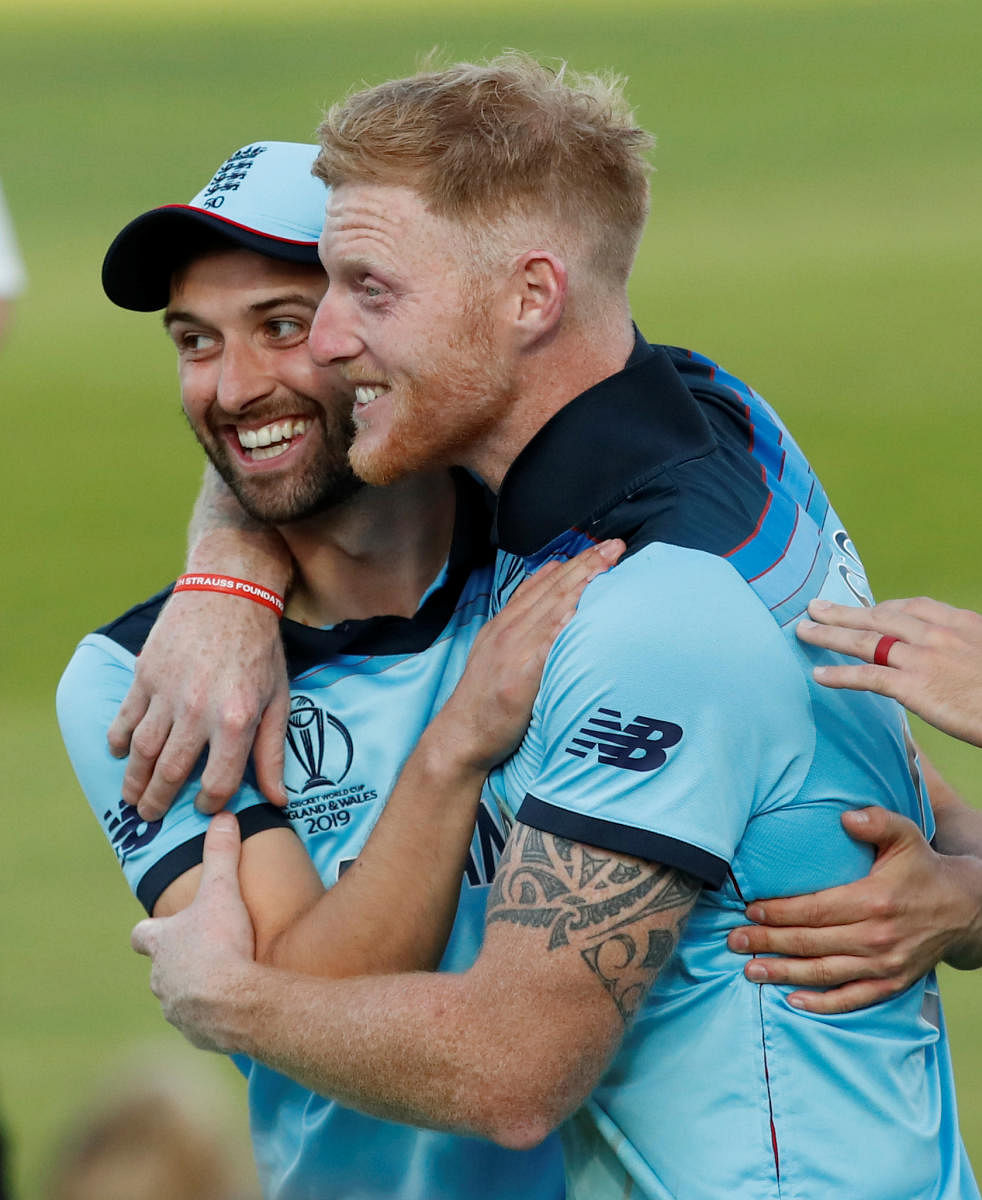 England's Mark Wood and Ben Stokes celebrate after winning the World Cup. Reuters