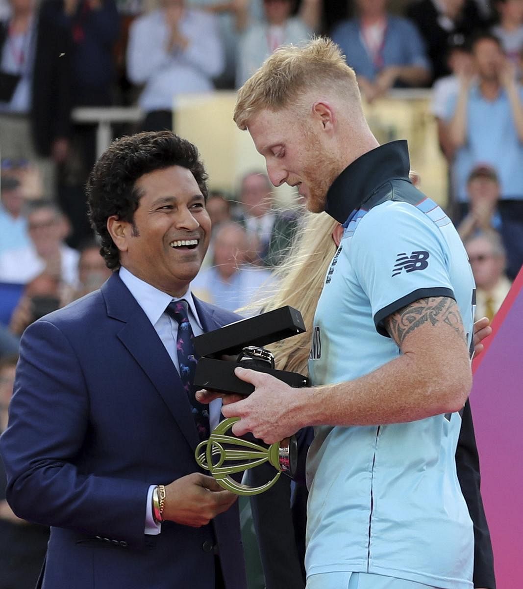 Ben Stokes receives the Player of the Match award from former Indian cricketer Sachin Tendulkar after his team won the Cricket World Cup final match between England and New Zealand at Lord's cricket ground in London, England, Sunday, July 14, 2019. AP/PTI