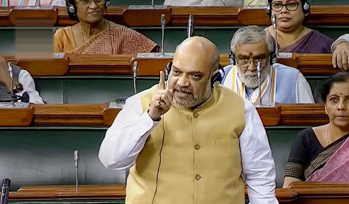 Union Home Minister Amit Shah speaks in the Lok Sabha during the Budget Session of Parliament, in New Delhi, Monday, July 15, 2019. (LSTV/PTI Photo)