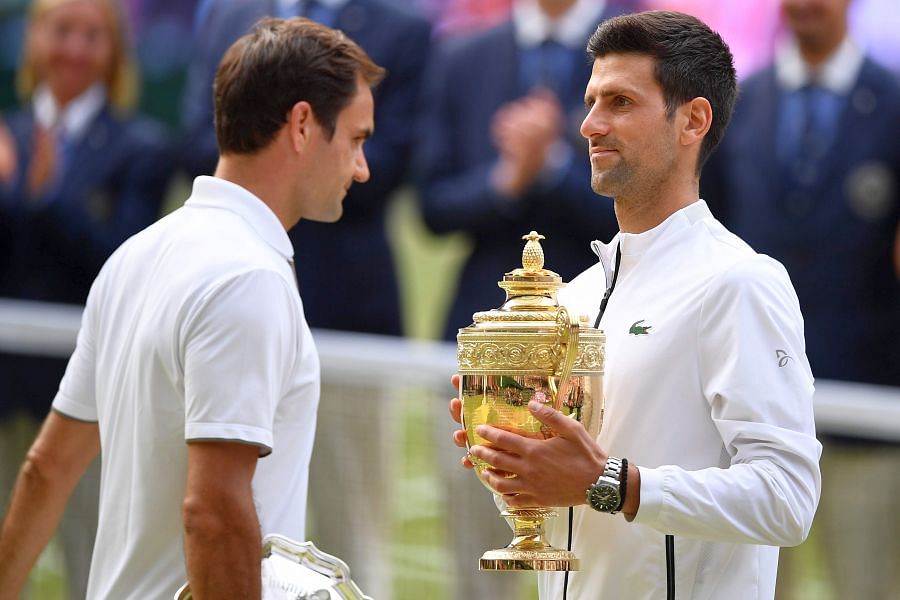 Roger Federer (left) and 2019 champion Novak Djokovic after the final. Picture credit: AFP