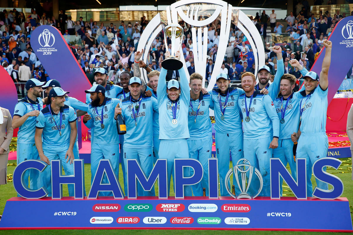 England's Eoin Morgan and teammates celebrate winning the ICC Cricket World Cup Finals with the trophy at Lord's, London, Britain. Action Images via Reuters