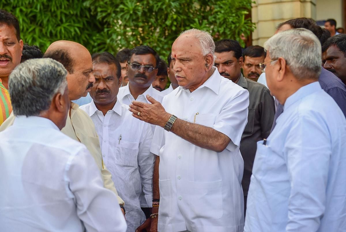 BJP State President B S Yeddyurappa with party leaders after the speaker announced that the vote of confidence will happen on Thursday, during the State Assembly session at Vidhana Soudha in Bengaluru on Monday. PTI photo