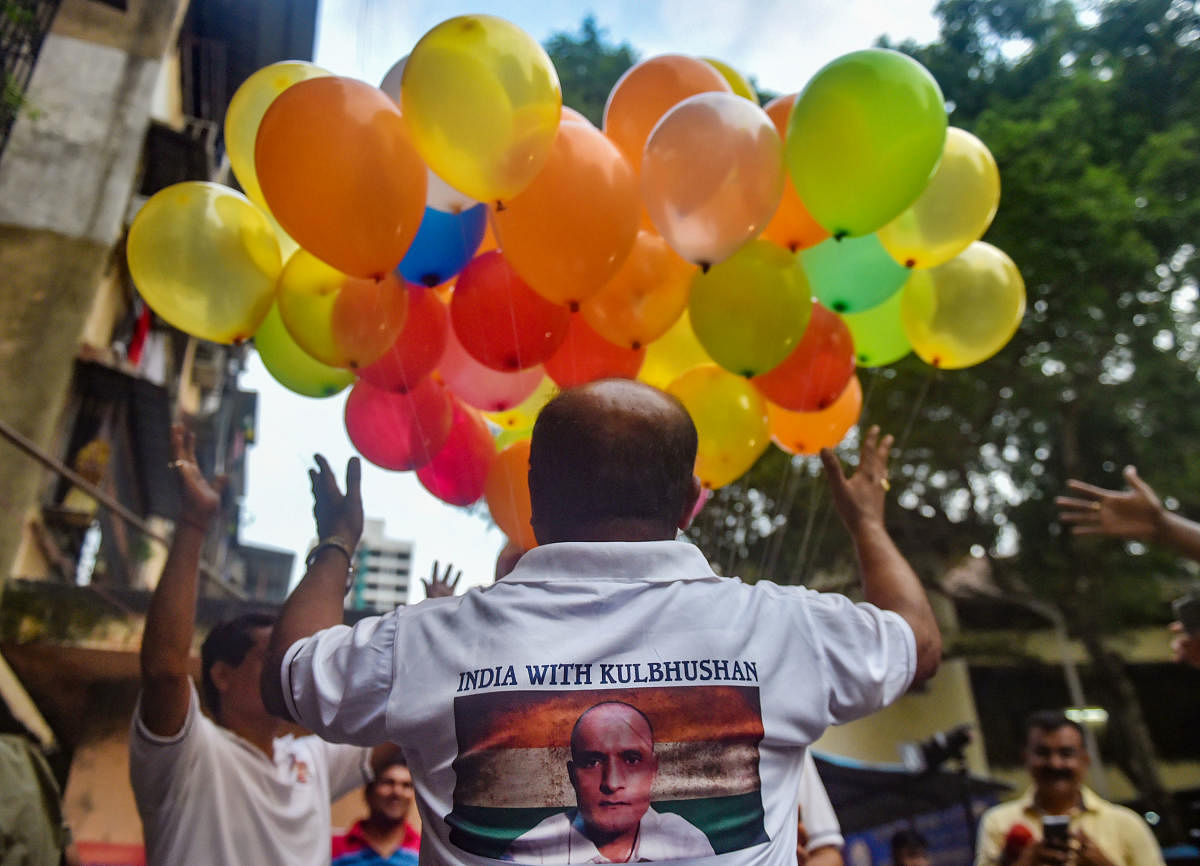 Supporters of Kulbhushan Jadhav celebrate after International Court of Justice's verdict, in Mumbai on Wednesday. PTI photo