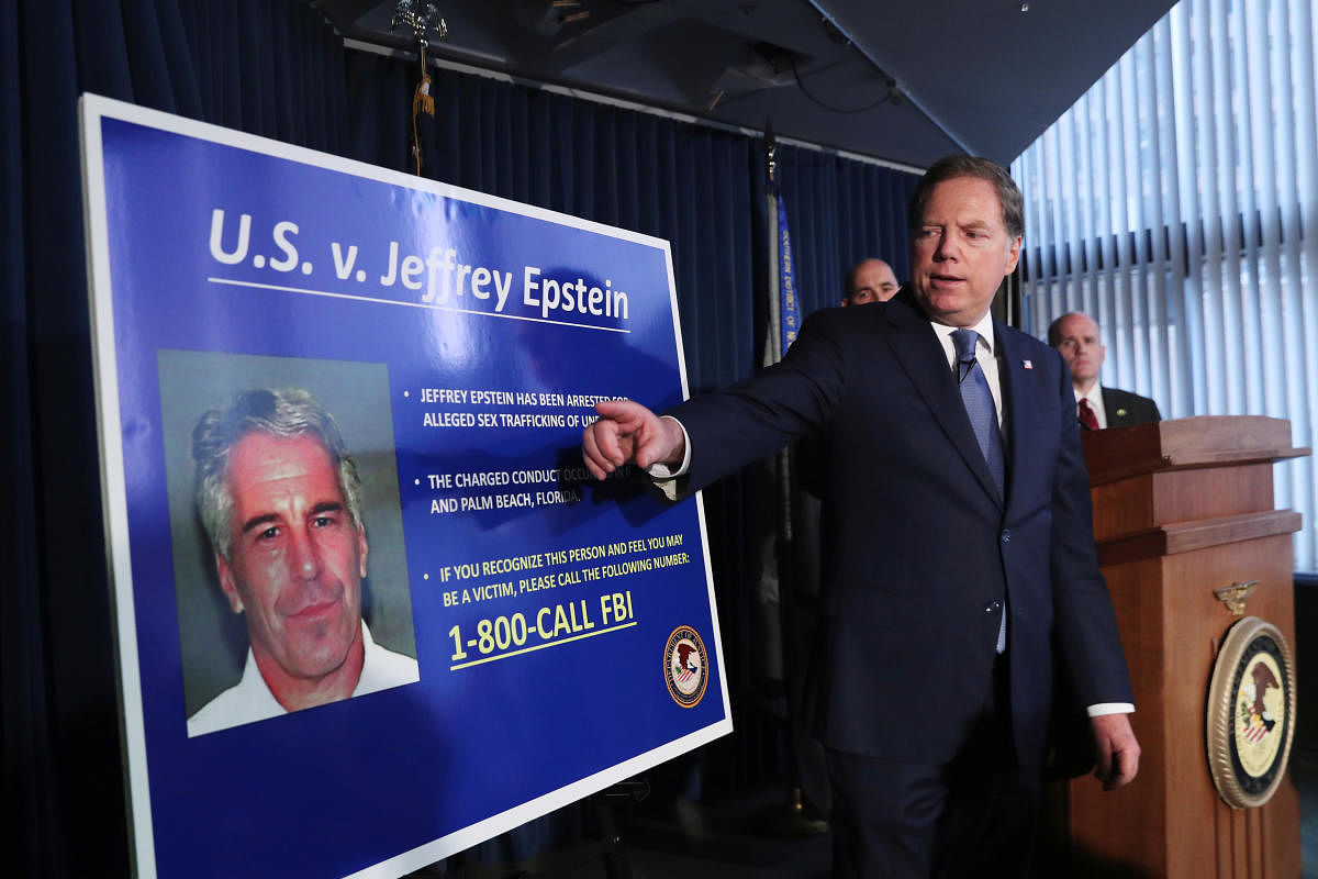 Geoffrey Berman, US Attorney for the Southern District of New York, points to a photograph of Jeffrey Epstein as he announces the financier's charges of sex trafficking of minors and conspiracy to commit sex trafficking of minors (Reuters Photo)