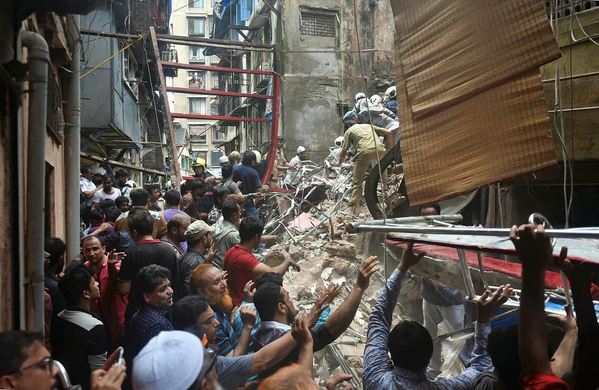 Rescue and relief work underway after the collapse of the four-storey Kesarbai building at Dongri in Mumbai. (PTI Photo)