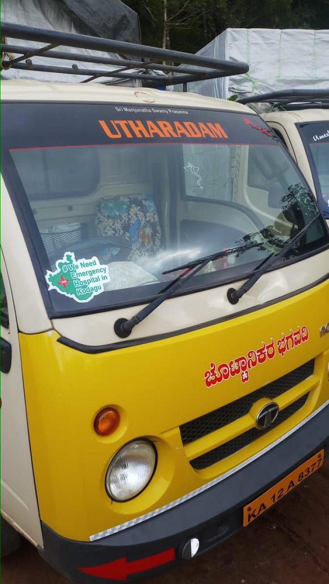 A sticker supporting the campaign for an emergency hospital in Kodagu pasted on a vehicle in Mahadevpet.