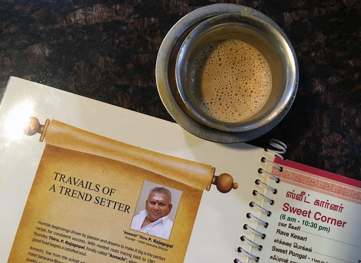 A file photo shows the image of P. Rajagopal, founder of the Saravana Bhavan food chain, on a menu at one of the popular restaurants in Chennai. (AFP)