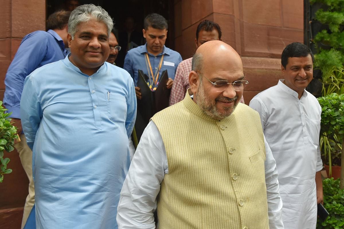 Union Home Minister Amit Shah with BJP MP Bhupendra Yadav during the Budget Session at Parliament, in New Delhi on July 10, 2019. PTI