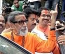 Shiv Sena chief Bal Thackeray along with son Uddhav after casting his vote for Maharashtra assembly elections at Bandra, in Mumbai on Tuesday. PTI