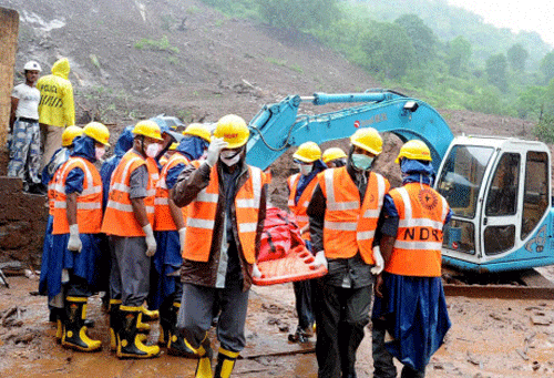 NDRF personnel during rescue operation at the site of a landslide in Malin village in Pune, Maharashtra. PTI photo