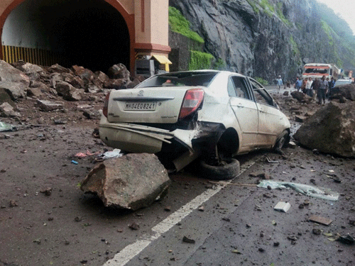 A damaged car outside the Adhoshi tunnel near Pune on Pune-Mumbai expressway after a major landslide on Sunday. PTI Photo