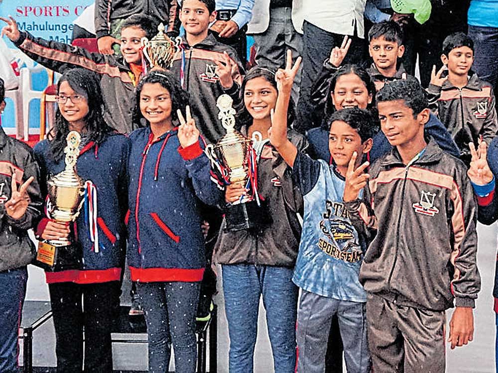 The Maharashtra swimmers celebrate their title success on Friday.