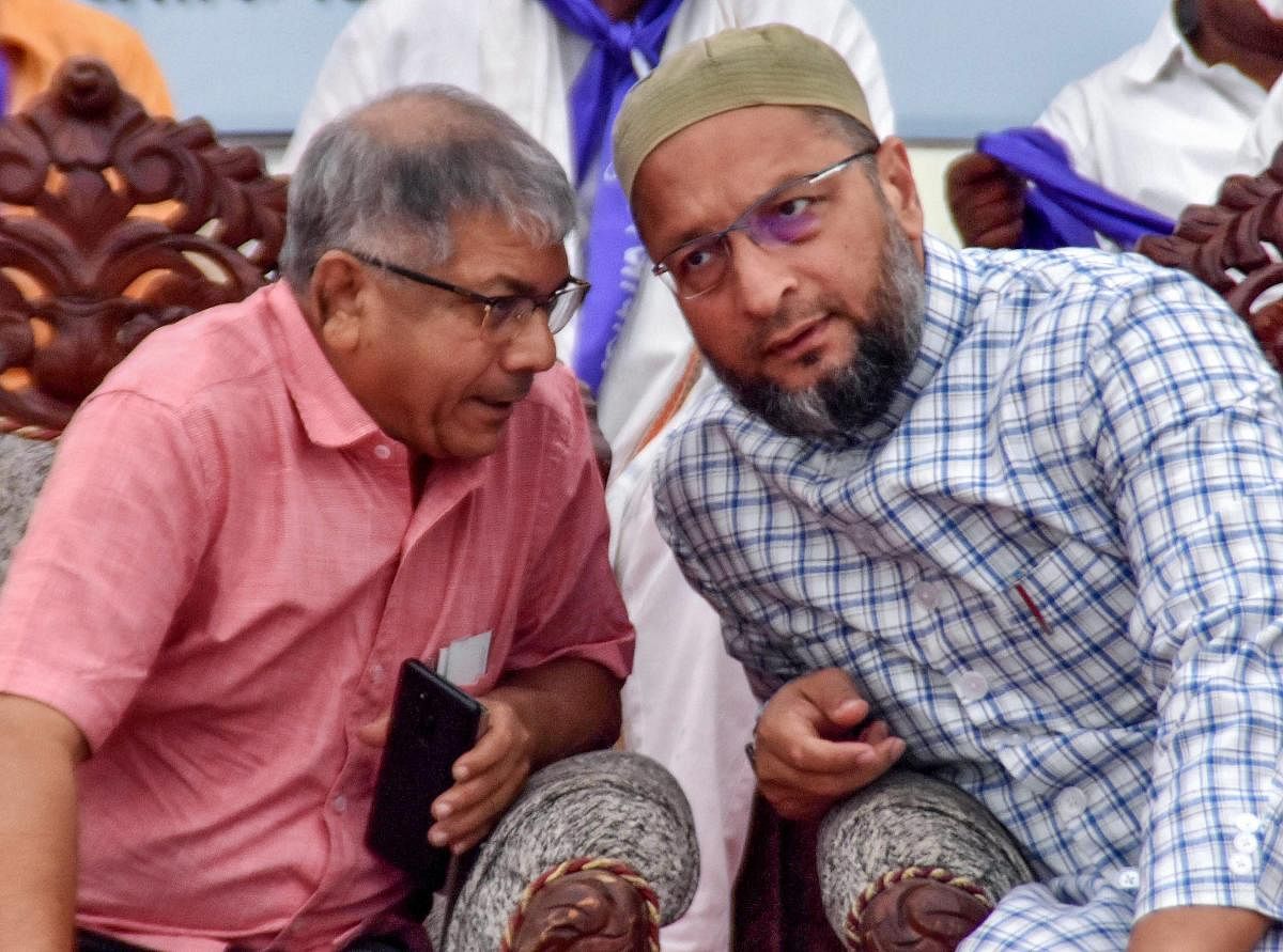 AIMIM leader Asaduddin Owaisi with Dalit leader Prakash Ambedkar during a public meeting for the upcoming Lok Sabha polls, in Nagpur, Maharashtra on April 1, 2019. (PTI Photo) 