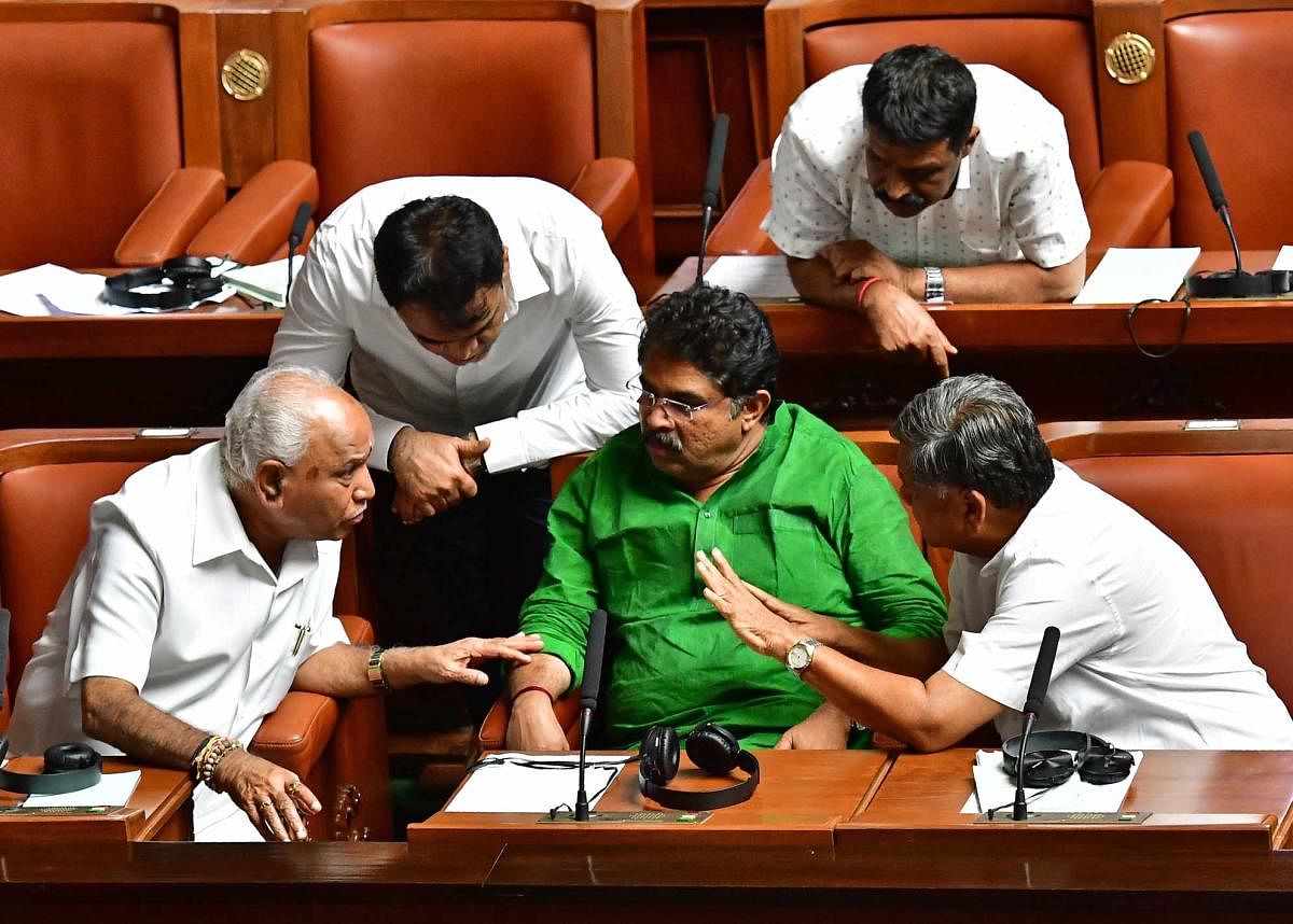 Leader of the Opposition B S Yeddyurappa, BJP leaders R Ashoka, Jagadish Shettar and Ashwathanarayan discuss a point during the Assembly session in Vidhana Soudha on Friday. DH Photo