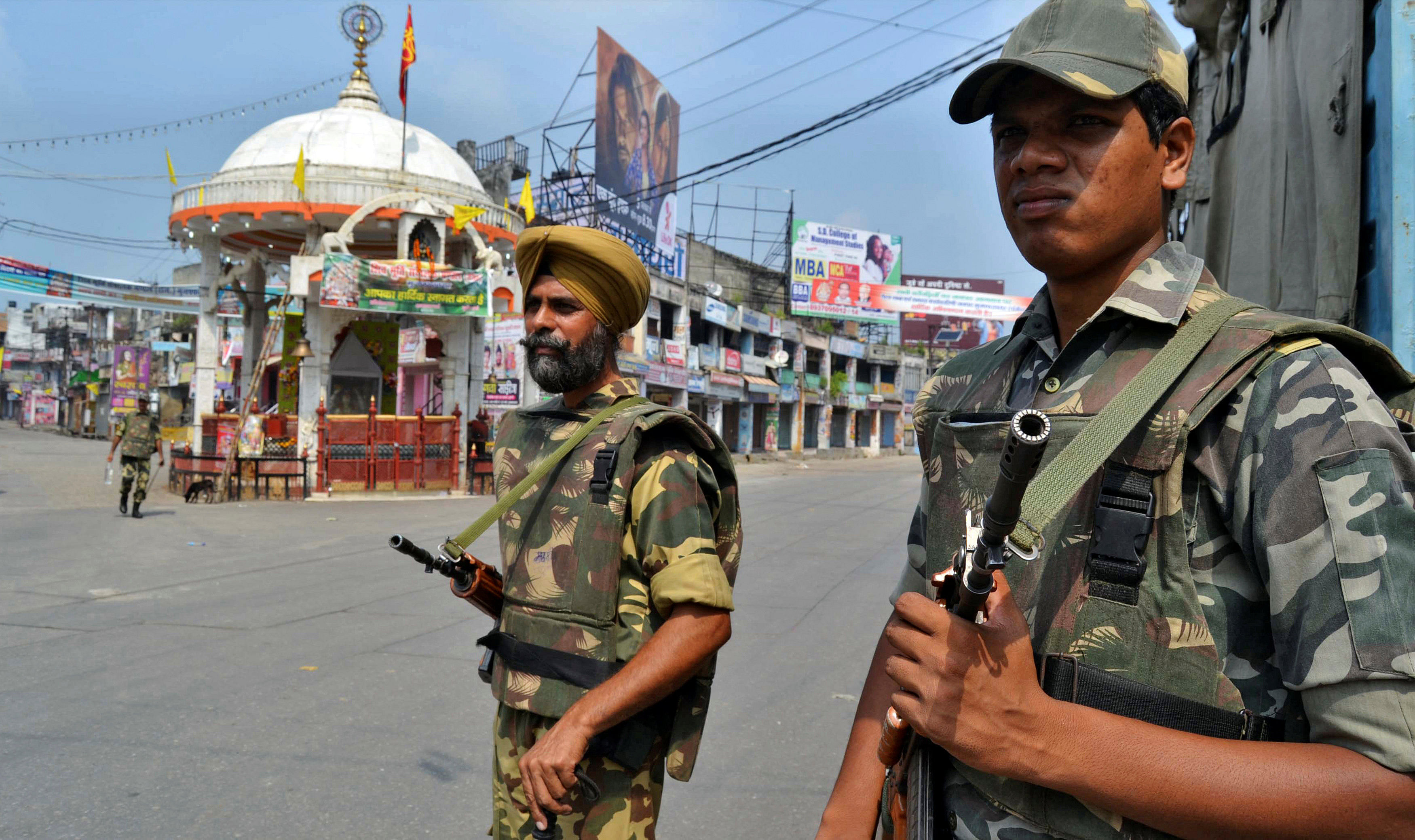 Soldiers stand guard on a deserted street during a curfew in Muzaffarnagar. (Reuters File Photo) 