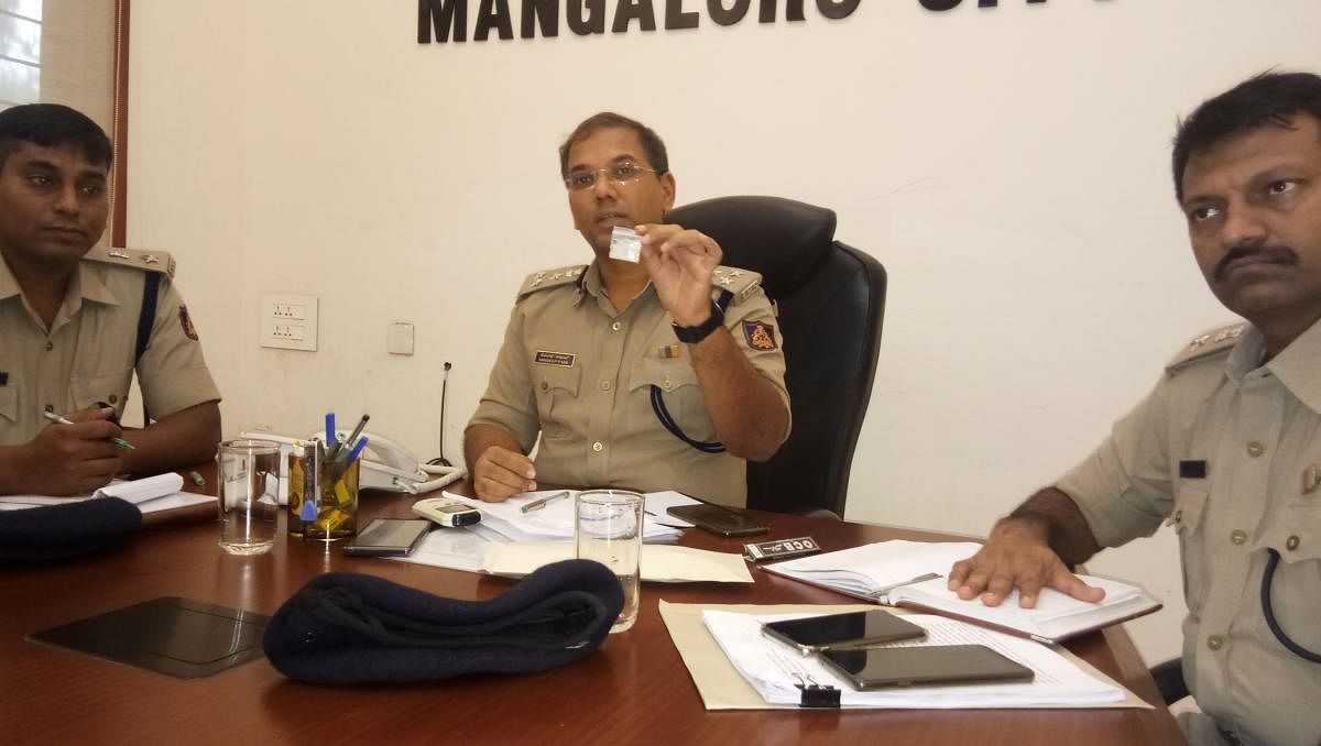 City Police Commissioner Sandeep Patil shows the packet of illicit drug, seized during the raids in Mangaluru.