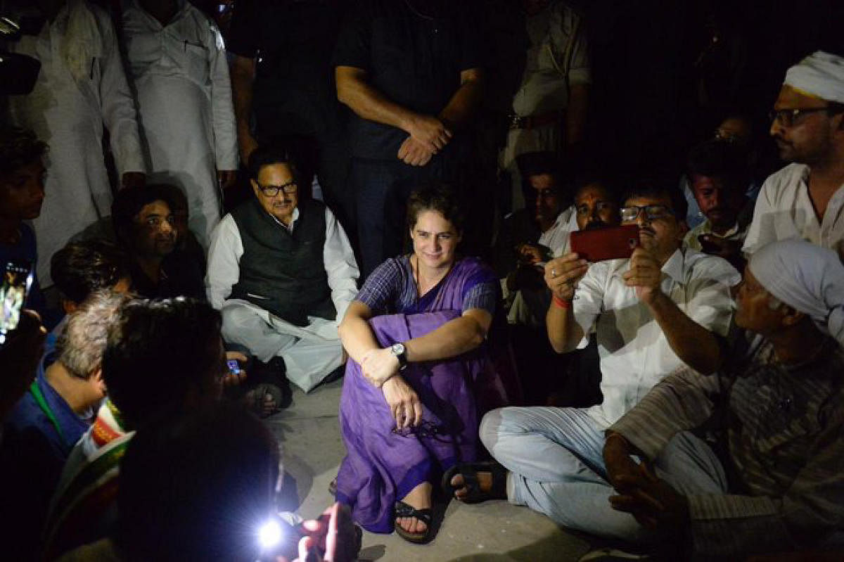 Congress General Secretary Priyanka Gandhi Vadra sat on a dharna at Chunar Fort Guest House , after she was placed under detention when she was on her way to Sonbhadra, where 10 people were gunned down this week, in Mirzapur (PTI Photo)