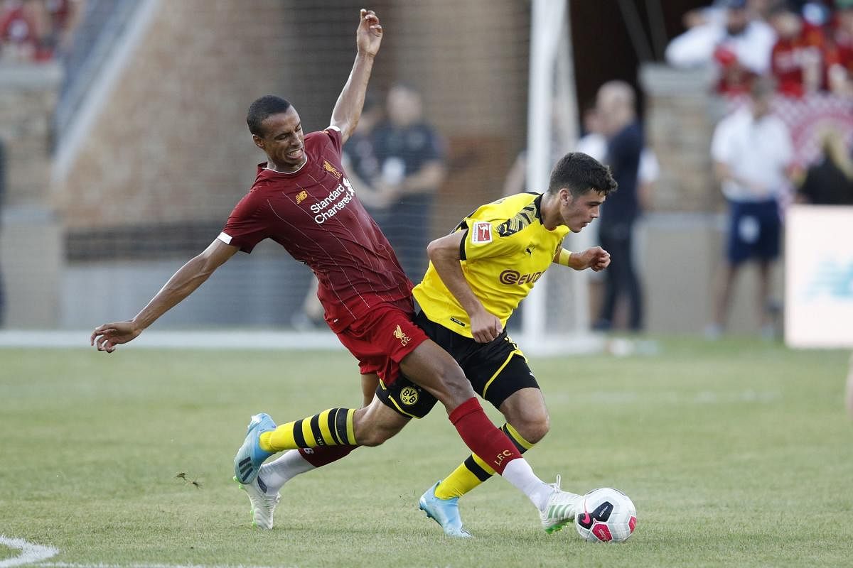 Joel Matip of Liverpool FC fights for the ball against Ömer Toprak #36 of Borussia Dortmund in the first half of the pre-season friendly match against at Notre Dame Stadium on July 19, 2019 in South Bend, Indiana. Joe Robbins/Getty Images/AFP