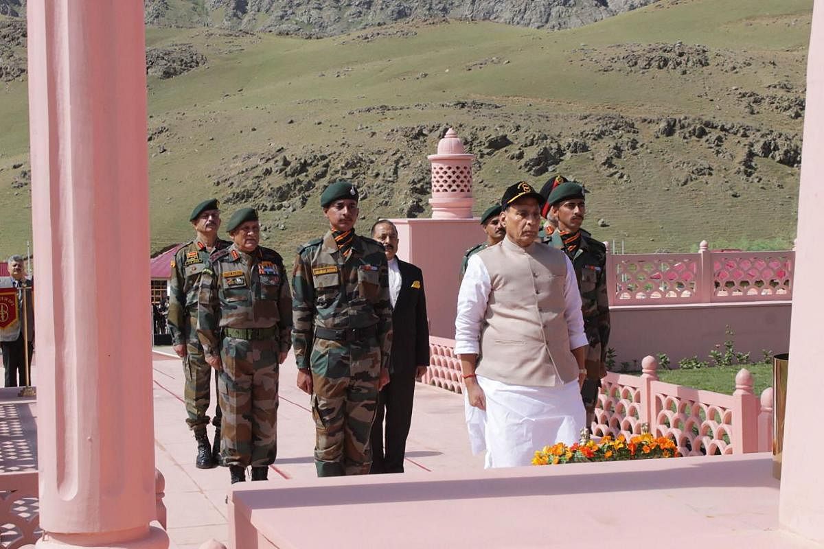 Defence Minister Rajnath Singh pays homage to martyrs at Kargil War Memorial in Drass sector of Kargil district, Saturday, July 20, 2019. PTI Photo